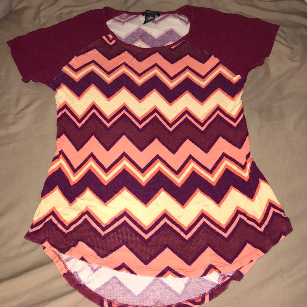 This is a Medium shirt. It is very fitted and soft